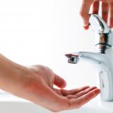 person using water tap