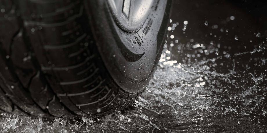 Tyre making a splash in a puddle